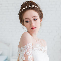 Yolev bride wearing scattered pearl pins showing finished wedding hairstyle