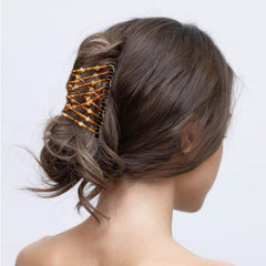 YOLLVKOT creating a tidy low bun for elegant event-ready look