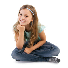 YONOY hand holding headband next to coin showing slim size and portability benefit