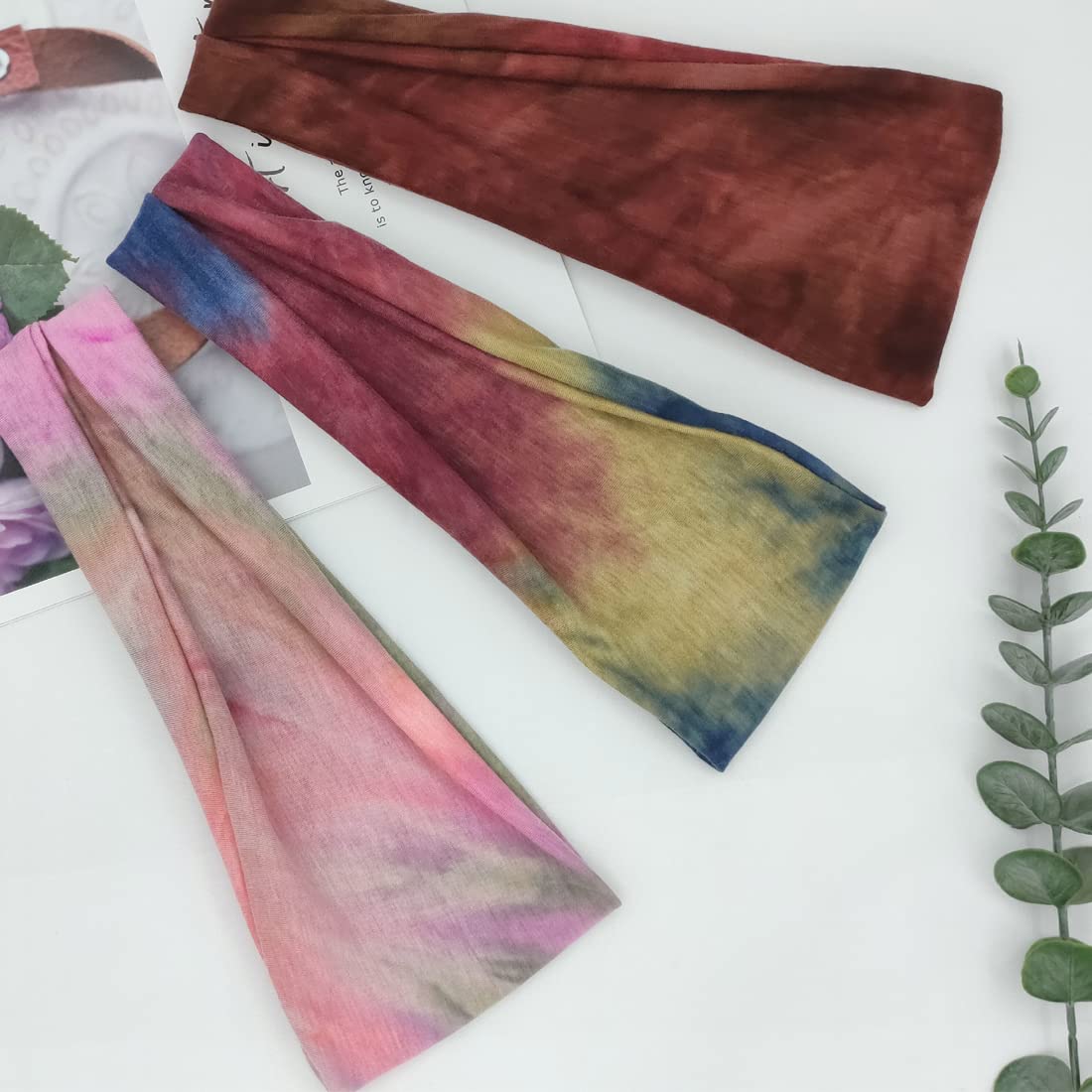 YONUF headband held by hand to show size and stretch for most head shapes