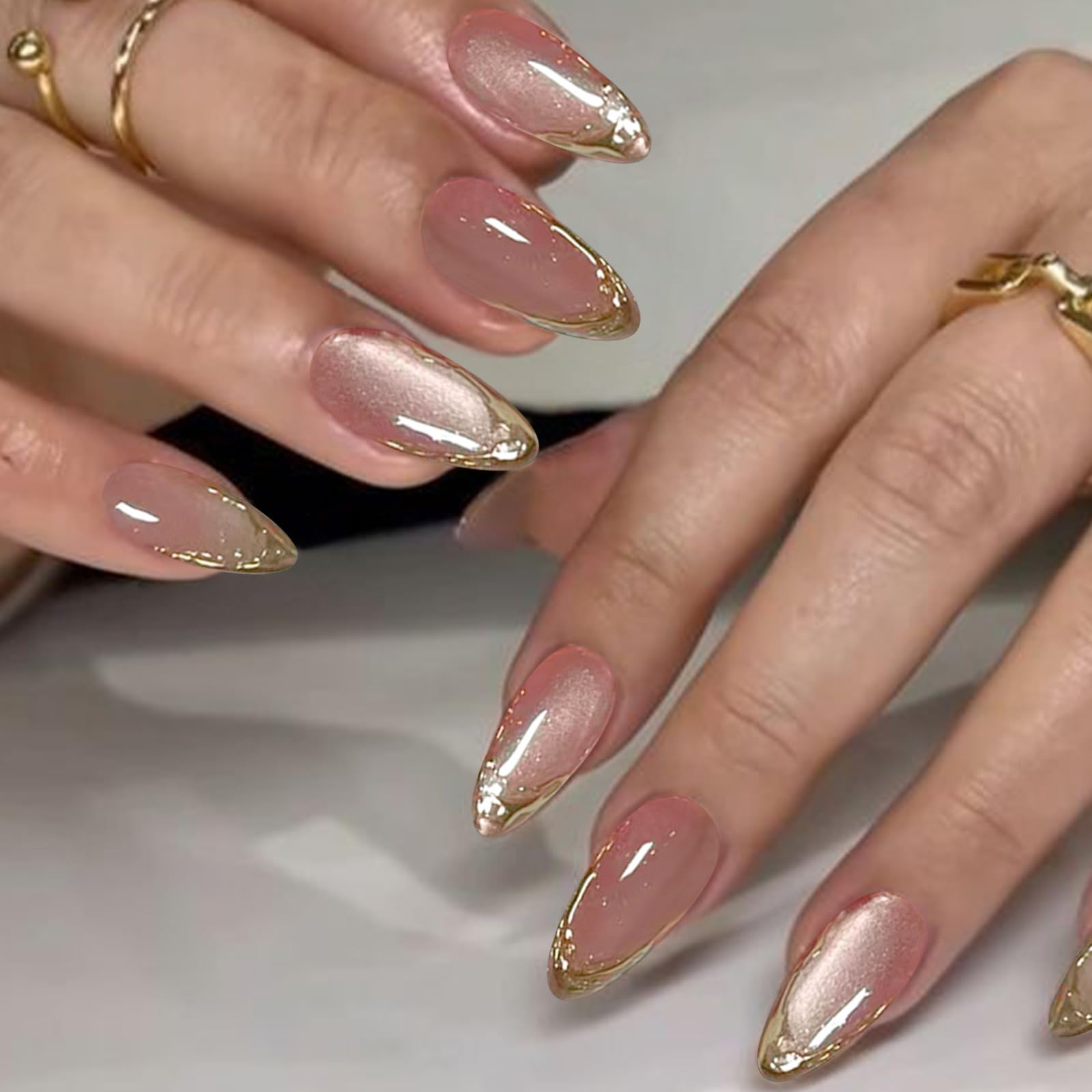 YOSOMMK close-up of cat-eye gloss and gold French tip showcasing shimmer