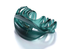 YOUXUAN hair claw holding a bun in place on model demonstrating reliable all-day hold benefit