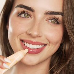 YuGlo peach lip mask on nightstand illustrating bedtime routine convenience