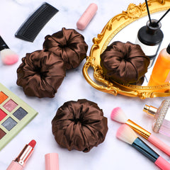 Yuxung bun donut held in hand demonstrating compact, travel-ready size