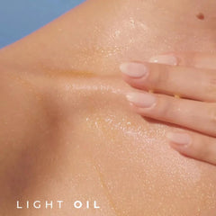 Yves Rocher close-up of pearly particles in oil showing luminous texture benefit: soft glow
