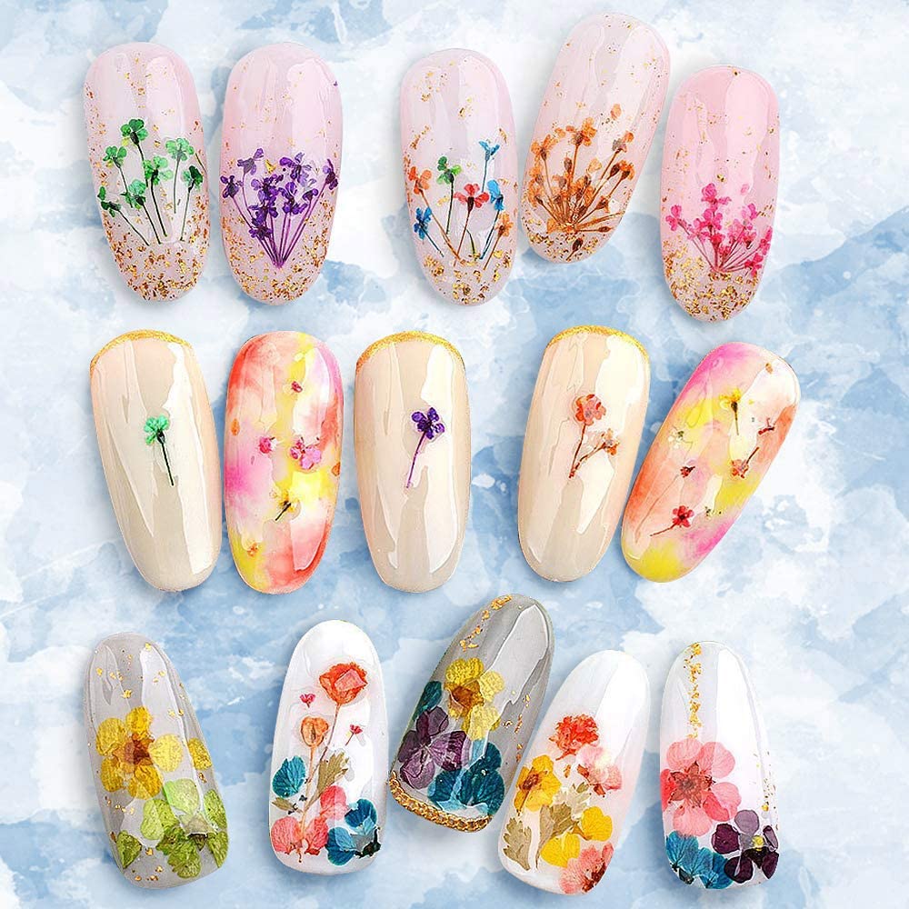 YWLI nails in progress with flowers applied showcasing easy placement and visual impact