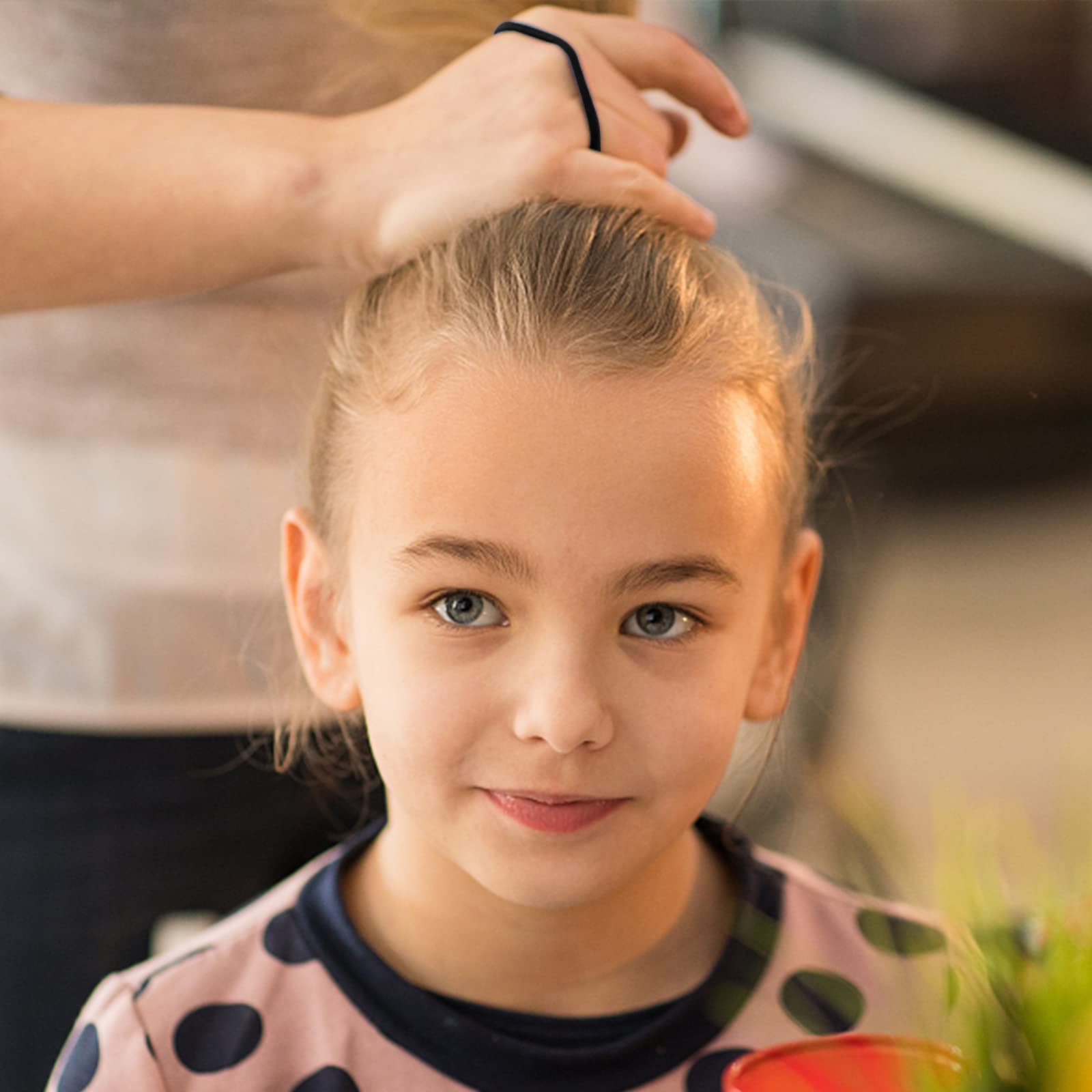 YXYL used in a high ponytail showing secure hold during activity