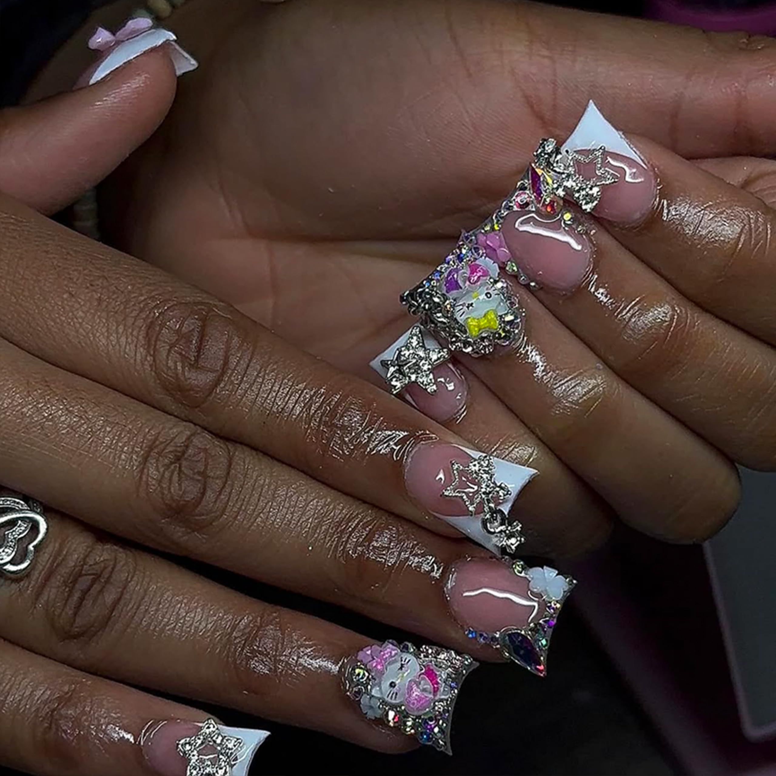 ZAKCBEAUR nail charms in party setting showing festive, camera-ready manicure
