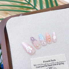ZASKHLD nails on fingers for size comparison showing available 12 sizes