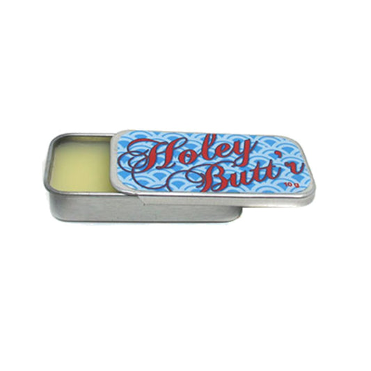 Zaya Body Jewelry front tin of Holey Butt’r showing compact size and label benefit