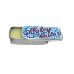 Zaya Body Jewelry front tin of Holey Butt’r showing compact size and label benefit