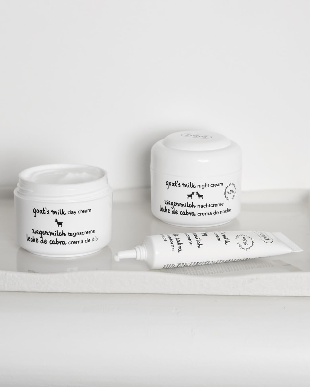 Ziaja goat's milk cream in hand scale view illustrating 50 ml size and travel-friendly benefit
