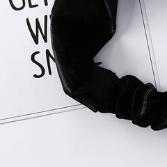 Ziper headband next to ruler showing compact size and wearable scale