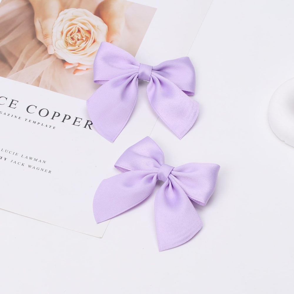 Zolyco two bows flat lay showing matching pair for coordinated looks
