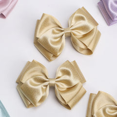 Zolyco bow at ponytail base enhancing hairstyle stability and shine