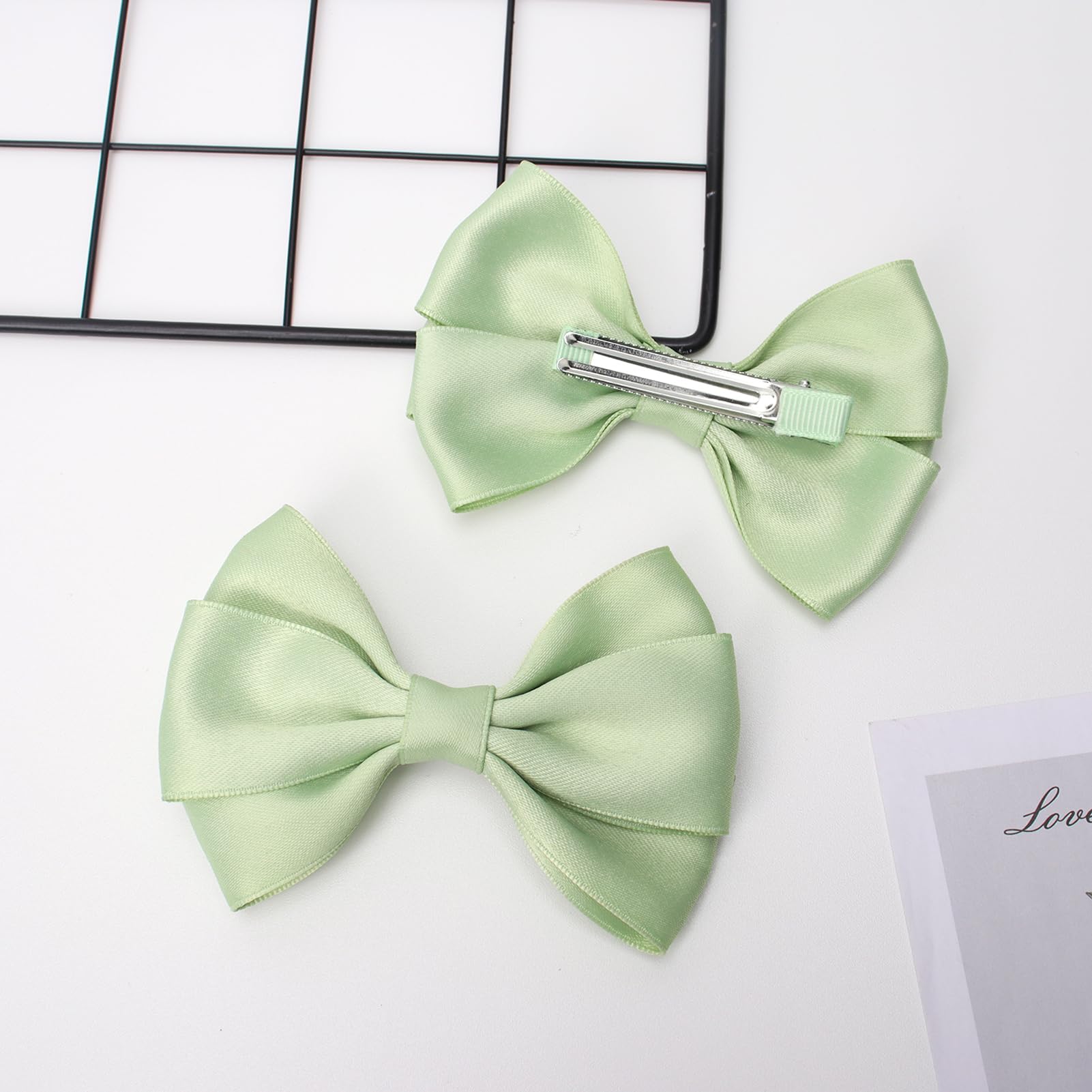 Zolyco double bow profile side emphasizing layered design and elegant silhouette