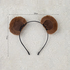 ZOONAI headband beside a ruler for scale showing one-size fit benefit