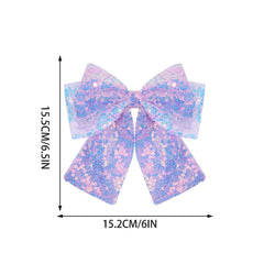 ZOONAI bow next to adult hand illustrating compact size and lightweight benefit