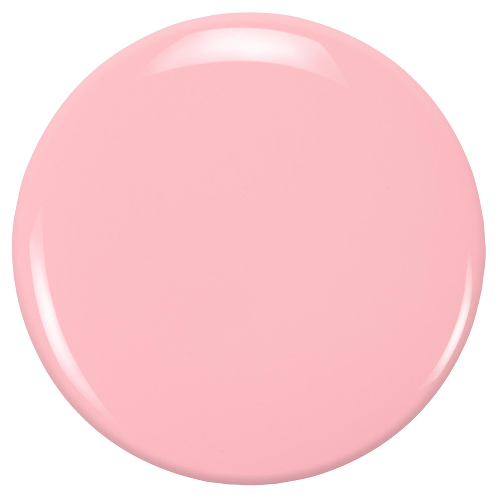ZOYA Joey swatch on toes in sunlit scene highlighting wearable warm pink tone